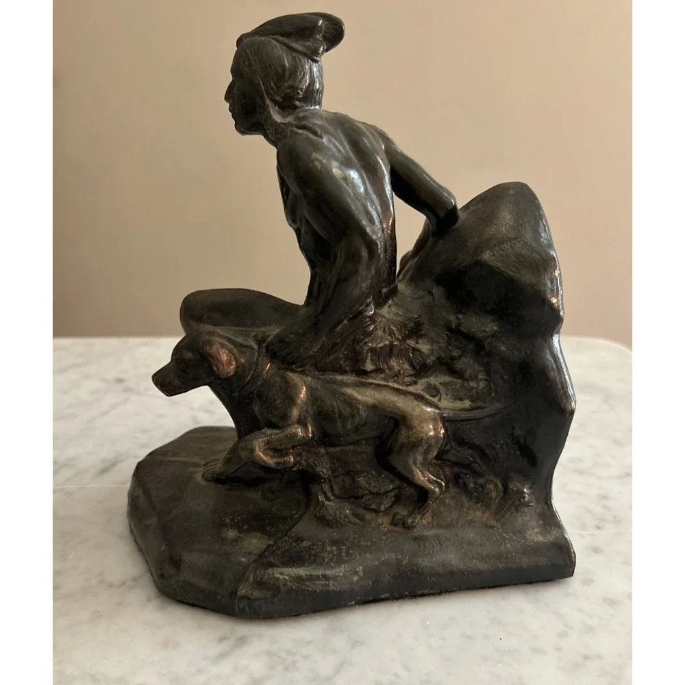Antique Meal metal cast Indian bookends. Good condition.